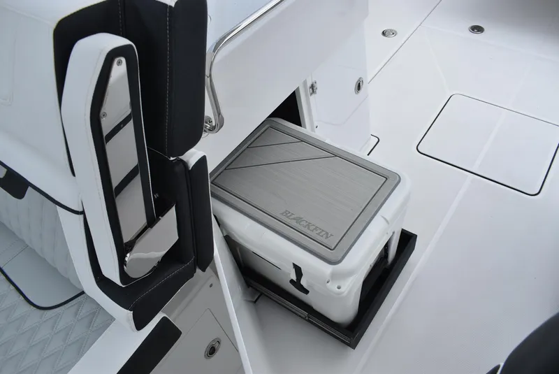 Slide: The Image of 2025 Blackfin 272 DC boat interior with integrated cooler storage. - 18