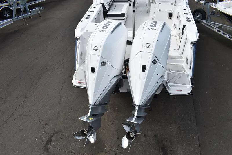 Slide: The Image of 2025 Blackfin 272 DC boat with dual 300 V8 outboard engines, rear view. - 5