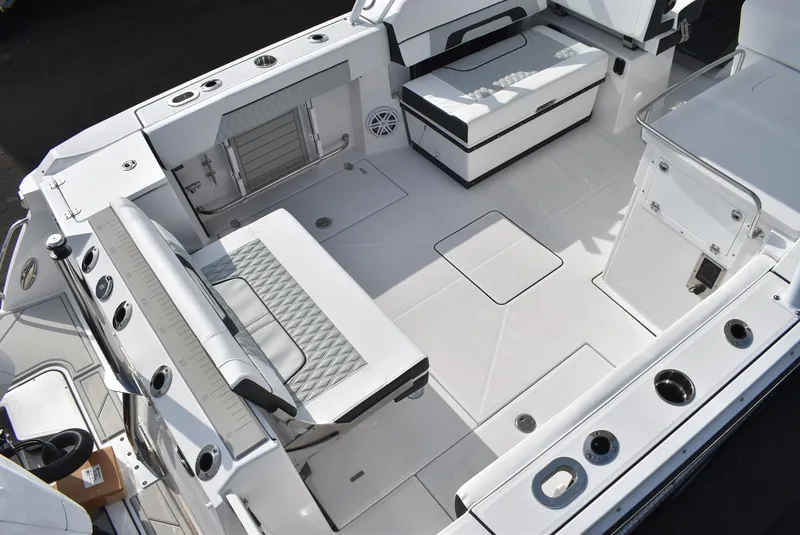Slide: The Image of 2025 Blackfin 272 DC boat interior with seating and storage compartments. - 9