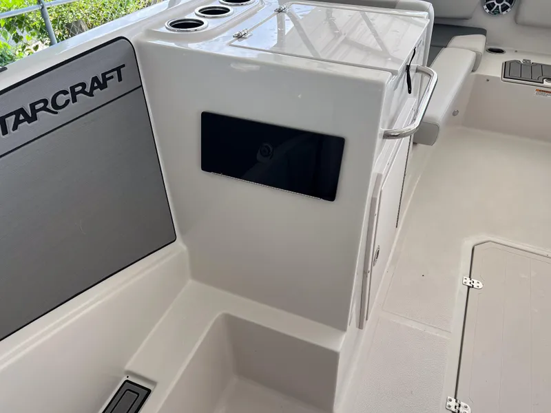 Slide: The Image of Interior of 2026 Starcraft SVX 231 OB boat, featuring seating and storage compartments. - 17