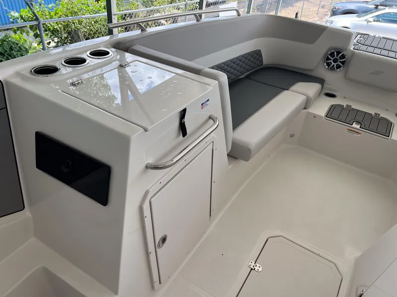 Slide: The Image of 2026 Starcraft SVX 231 OB boat interior with seating and storage compartments. - 18