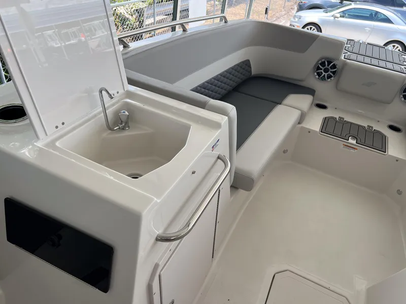 Slide: The Image of 2026 Starcraft SVX 231 OB boat interior with sink, seating, and storage compartments. - 19