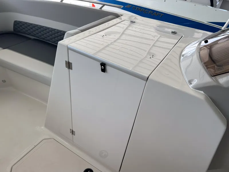 Slide: The Image of 2026 Starcraft SVX 231 OB boat interior with seating and storage compartment. - 20