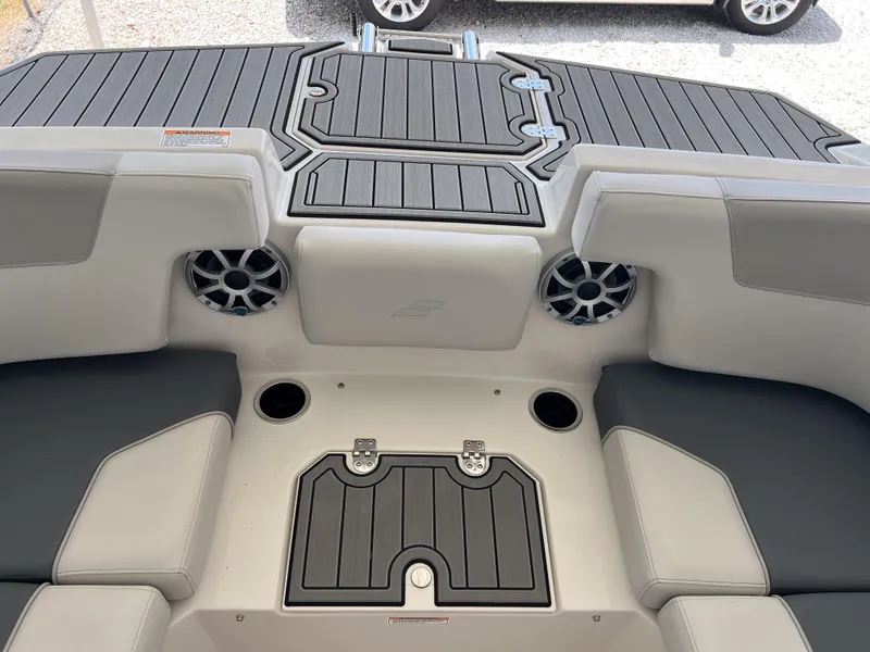 Slide: The Image of 2026 Starcraft SVX 231 OB boat interior with seating, speakers, and storage compartments. - 28