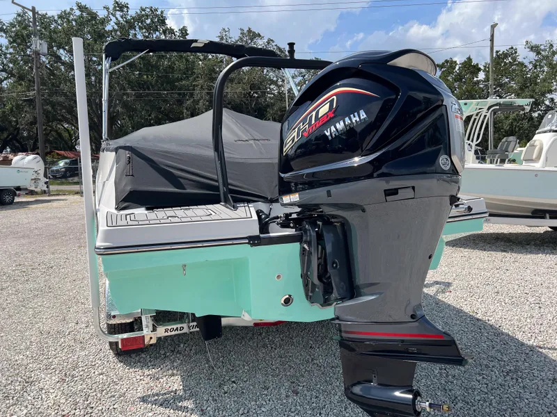 Slide: The Image of 2026 Starcraft SVX 231 OB boat with Yamaha outboard motor, parked on gravel. - 3