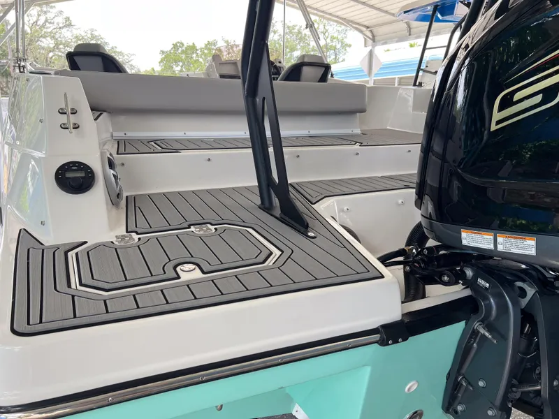 Slide: The Image of 2026 Starcraft SVX 231 OB boat with sleek deck and powerful outboard motor. - 7