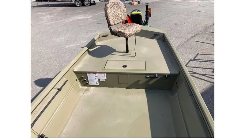 Slide: The Image of 2025 Lowe Roughneck RX1860 SC boat with camo seat, parked on pavement. - 5