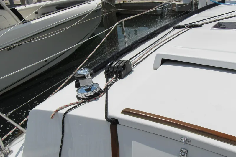 Slide: The Image of Sailboat deck with winch and ropes, CAL 34 model, 1968, docked at marina. - 7