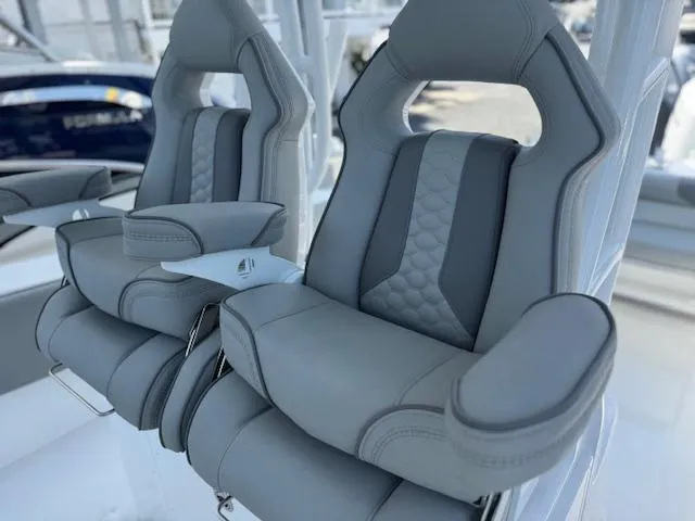 Slide: The Image of Luxury seating on 2025 Cape Horn 34 T boat, featuring plush gray upholstery and ergonomic design. - 13