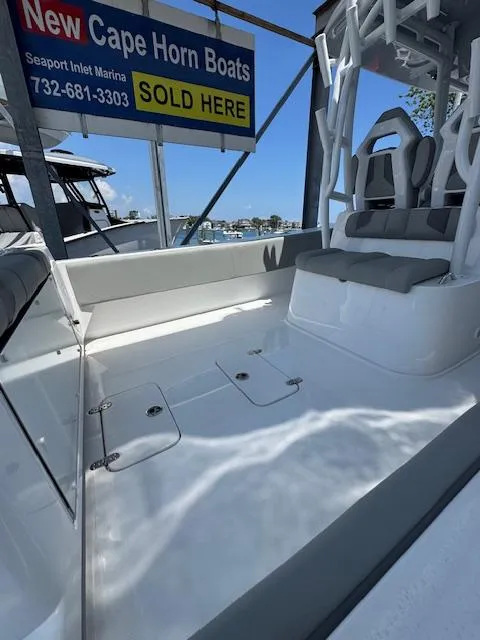Slide: The Image of 2025 Cape Horn 34 T boat interior at Seaport Inlet Marina, featuring seating and storage. - 4
