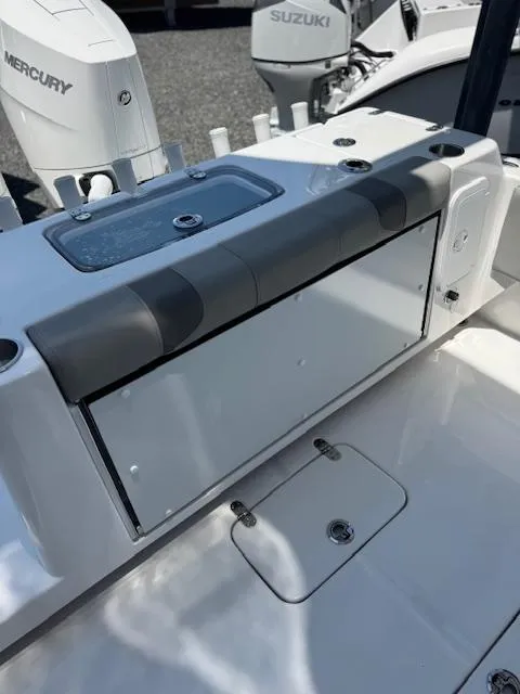Slide: The Image of 2025 Cape Horn 34 T boat interior with storage compartment and outboard motors. - 8