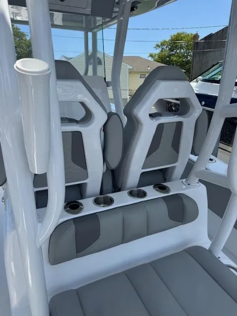 Slide: The Image of 2025 Cape Horn 34 T boat interior with modern seating and cup holders. - 11
