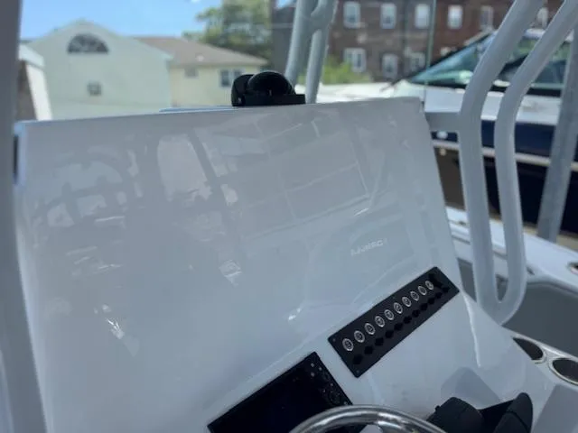 Slide: The Image of Console of a 2025 Cape Horn 34 T boat with control panel and steering wheel. - 14