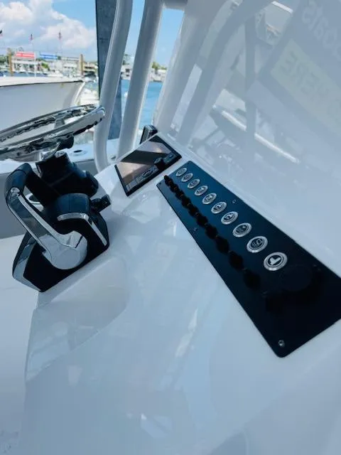 Slide: The Image of Control panel of 2025 Cape Horn 34 T boat with steering wheel and buttons. - 20