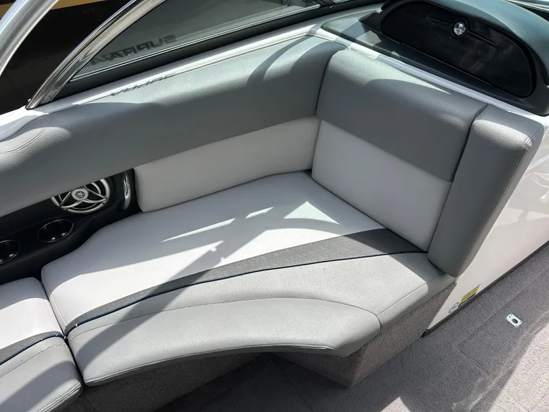 Slide: The Image of 2010 Supra Launch 21 V boat interior with gray seating and speaker detail. - 17