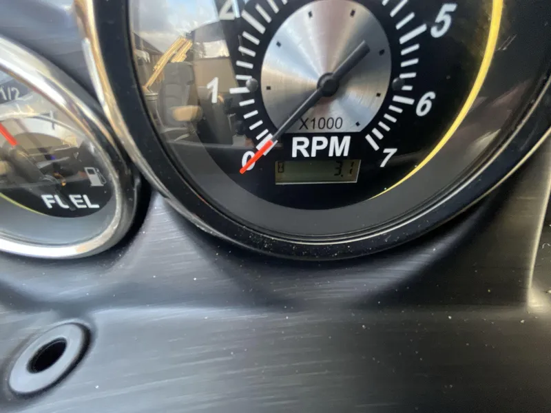 Slide: The Image of Close-up of 2025 South Bay S224RS dashboard showing RPM and fuel gauges. - 14