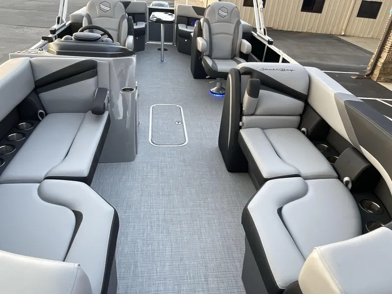 Slide: The Image of 2025 South Bay S224RS pontoon boat interior with gray seating and modern design. - 18