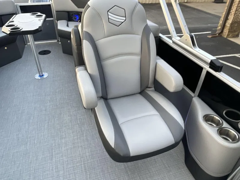 Slide: The Image of Luxurious seating on 2025 South Bay S224RS pontoon boat with cup holders and table. - 21