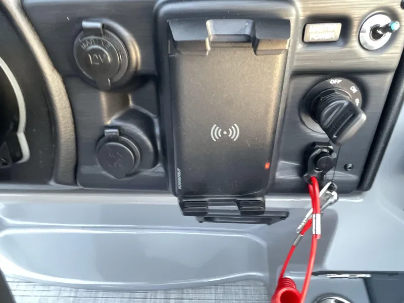 Slide: The Image of Control panel of 2025 South Bay S224RS with wireless charging and power outlets. - 27