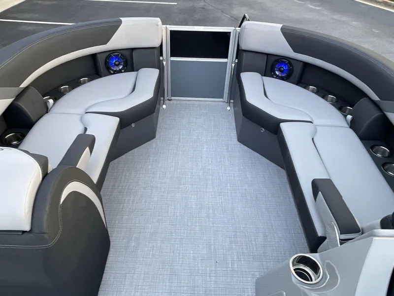 Slide: The Image of Luxurious interior of 2025 South Bay S224RS pontoon boat with plush seating and cup holders. - 28