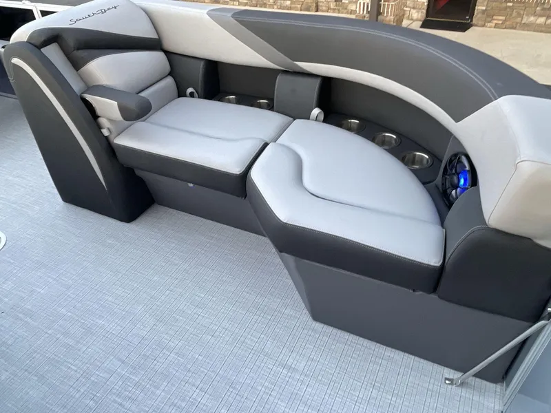 Slide: The Image of Luxurious seating on 2025 South Bay S224RS boat with cup holders and modern design. - 30
