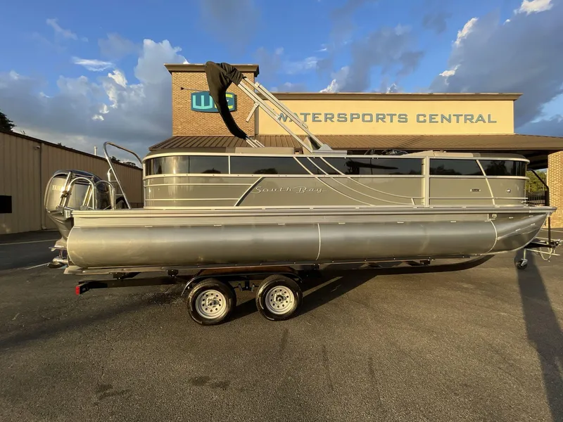 Slide: The Image of 2025 South Bay S224RS pontoon boat on trailer at Watersports Central dealership. - 37