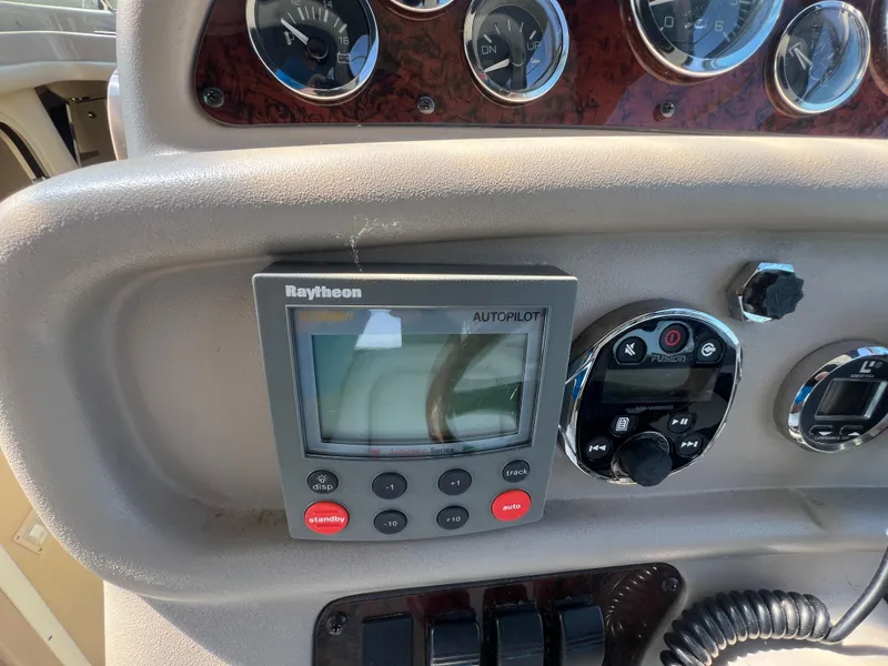 Slide: The Image of Control panel of a 1998 Sea Ray 290 Sundancer boat with Raytheon autopilot system. - 10