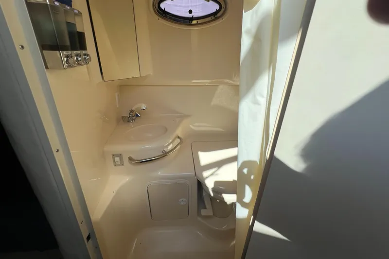 Slide: The Image of Engine compartment of a 1998 Sea Ray 290 Sundancer with twin MerCruiser engines. - 16