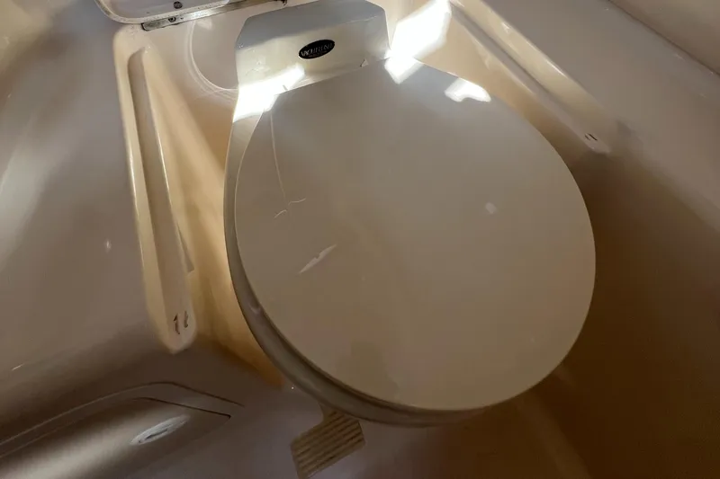 Slide: The Image of Engine compartment of a 1998 Sea Ray 290 Sundancer with MerCruiser 4.3L engine. - 17