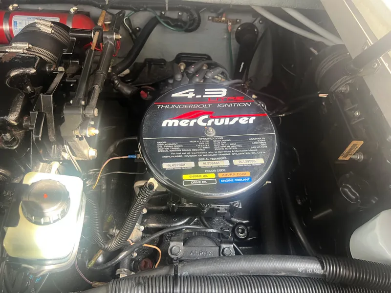 Slide: The Image of 1998 Sea Ray 290 Sundancer boat on trailer outside storage facility. - 19