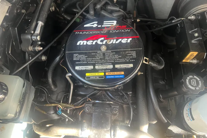 Slide: The Image of Twin propellers on a 1998 Sea Ray 290 Sundancer boat, displayed on a trailer. - 20