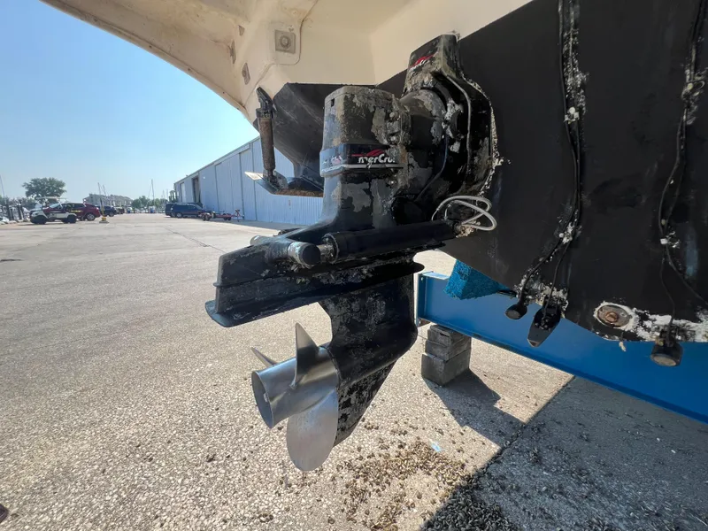 Slide: The Image of 1998 Sea Ray 290 Sundancer boat on trailer in indoor storage facility. - 23