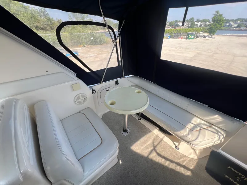 Slide: The Image of Interior of 1998 Sea Ray 290 Sundancer boat with seating and harbor view. - 6