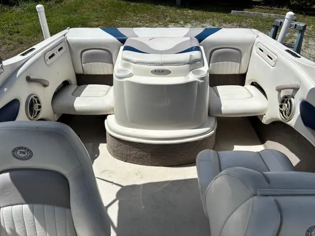 Slide: The Image of Interior of a 2006 Stingray 185 LS/LX boat with white seating and blue accents. - 10