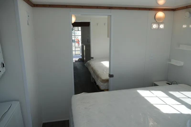 Slide: The Image of Interior of 2024 Catamaran Aqua Lodge, featuring a bright bedroom with modern design. - 39