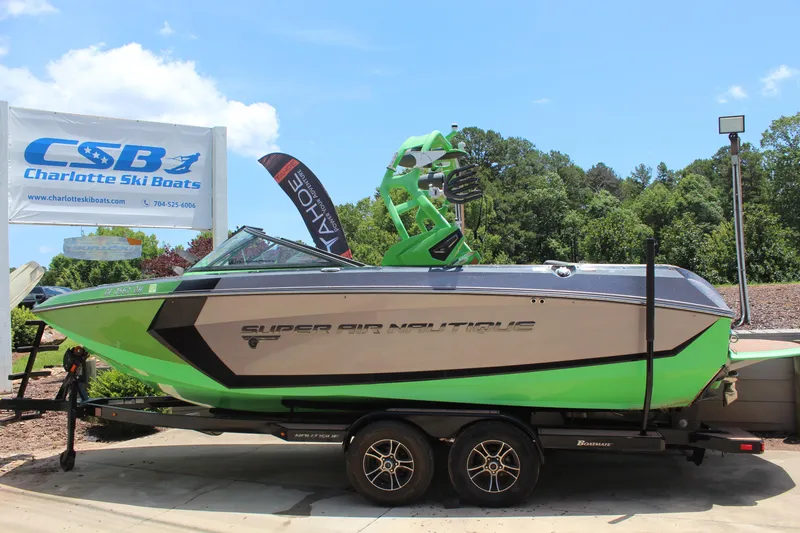 Slide: The Image of 2017 Nautique Super Air Nautique G23 boat in green, displayed at Charlotte Ski Boats. - 6
