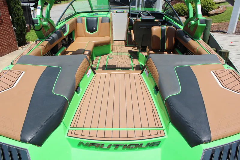 Slide: The Image of 2017 Nautique Super Air Nautique G23 interior with green and tan upholstery, showcasing luxury design. - 9