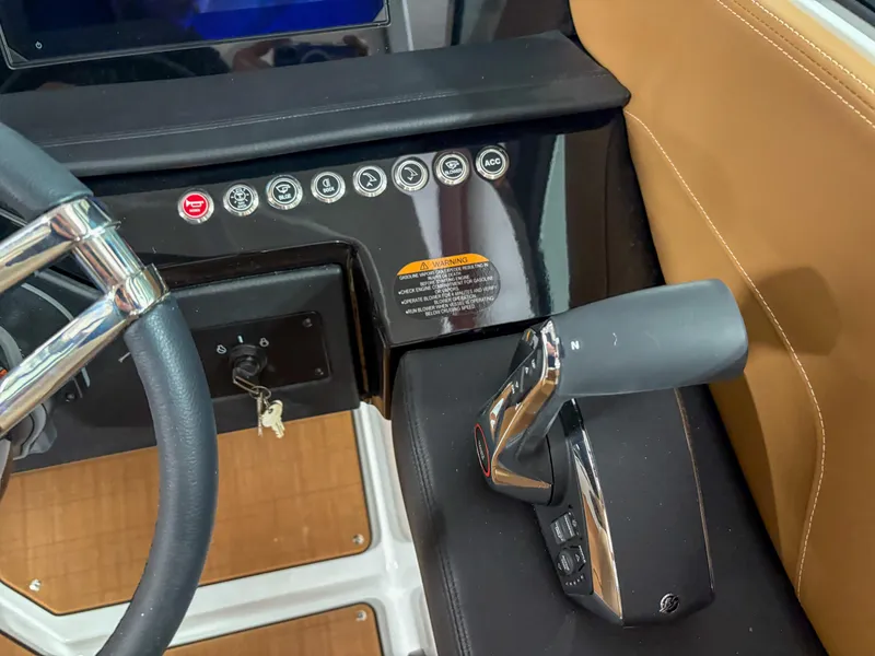 Slide: The Image of 2026 Four Winns H9 boat dashboard with steering wheel and control panel. - 14