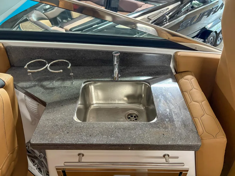 Slide: The Image of 2026 Four Winns H9 boat interior with sink and countertop. - 15