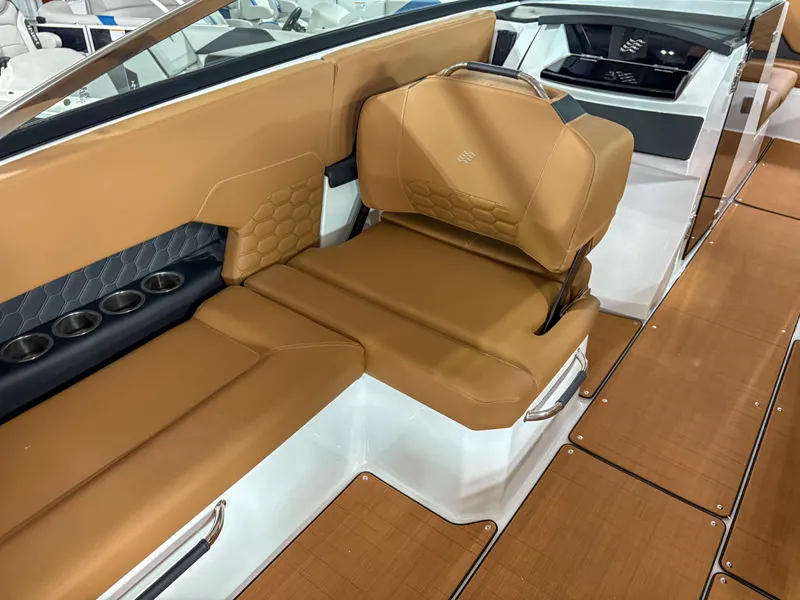 Slide: The Image of Luxurious interior of 2026 Four Winns H9 boat with tan leather seating. - 18