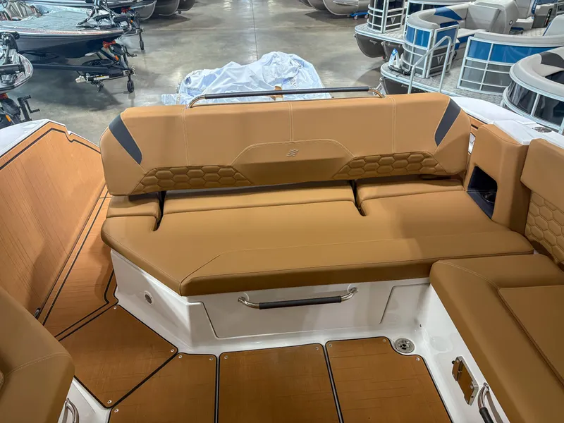 Slide: The Image of 2026 Four Winns H9 boat interior with tan seating and modern design. - 22