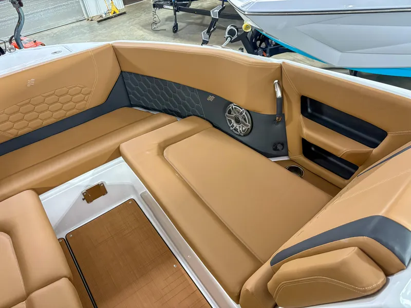 Slide: The Image of 2026 Four Winns H9 boat interior with tan leather seating and modern design. - 7