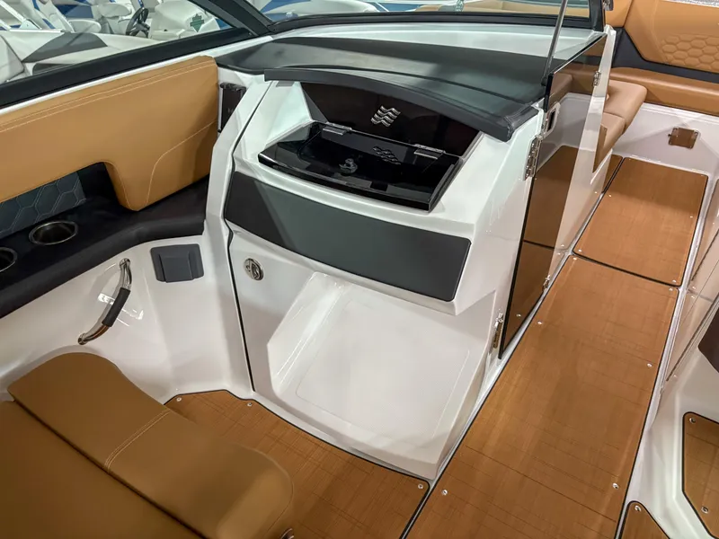 Slide: The Image of Interior of 2026 Four Winns H9 boat, featuring sleek design and tan seating. - 9
