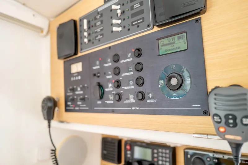 Slide: The Image of Control panel of a 2011 Lagoon 380 S2 yacht with communication equipment. - 11