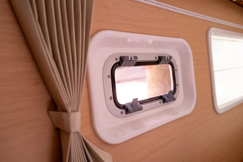 Slide: The Image of Interior view of Lagoon 380 S2 yacht window with beige curtains, 2011 model. - 19