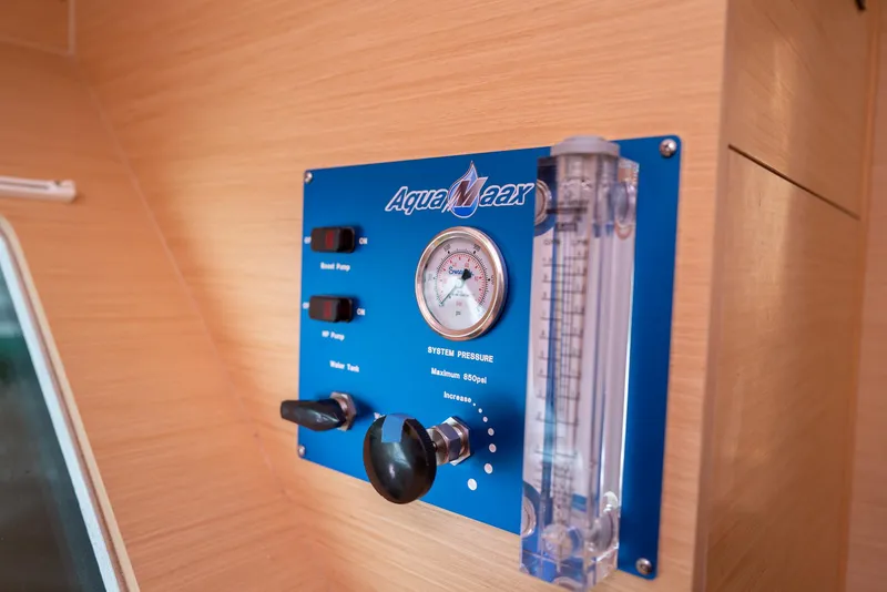 Slide: The Image of Control panel on Lagoon 380 S2 yacht, featuring pressure gauge and switches, 2011 model. - 25