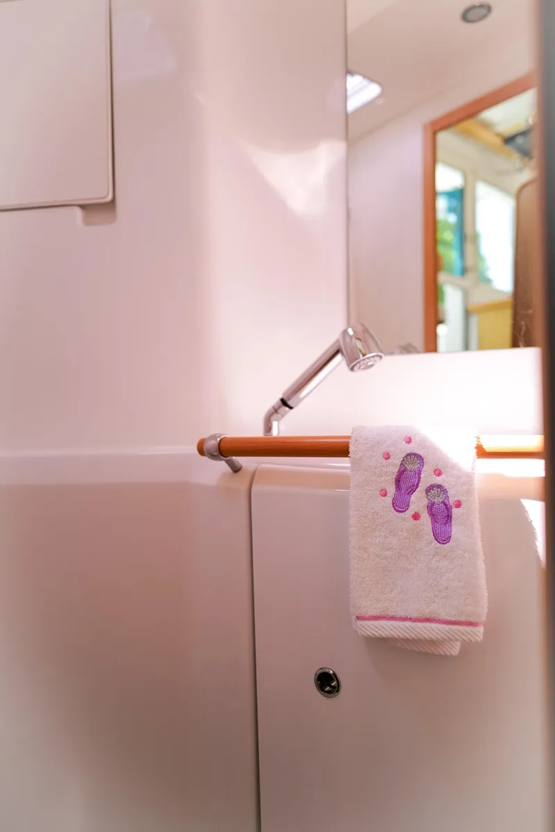 Slide: The Image of Lagoon 380 S2 2011 yacht bathroom with towel and modern fixtures. - 27