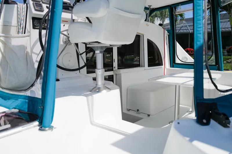 Slide: The Image of Interior of 2011 Lagoon 380 S2 catamaran with helm, seating, and table. - 3