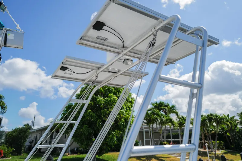 Slide: The Image of Solar panels on a Lagoon 380 S2 catamaran, 2011 model, under a clear blue sky. - 30