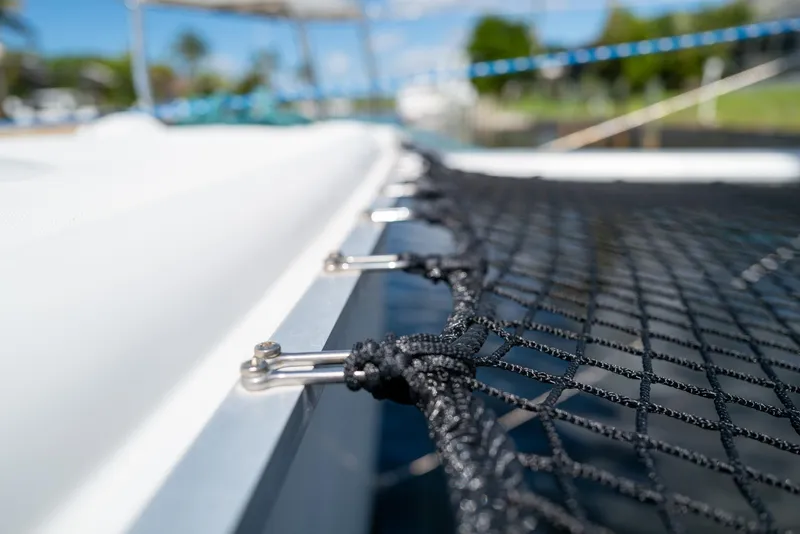 Slide: The Image of Close-up of netting on a 2011 Lagoon 380 S2 catamaran, with blurred background. - 38